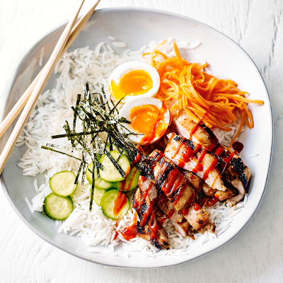Chicken rice bowl with soft-boiled egg and veggie pickle