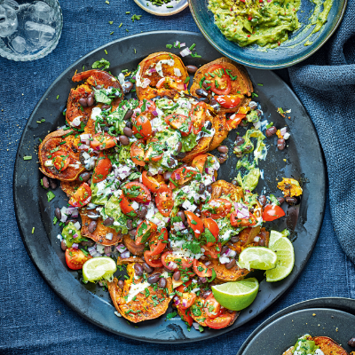loaded-sweet-potatoes-with-lime-crema-black-beans-guacamole